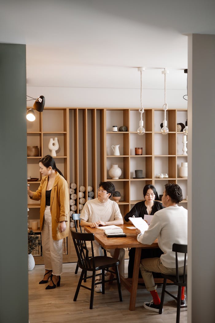 A diverse group of professionals having a meeting in a stylish and modern office space.